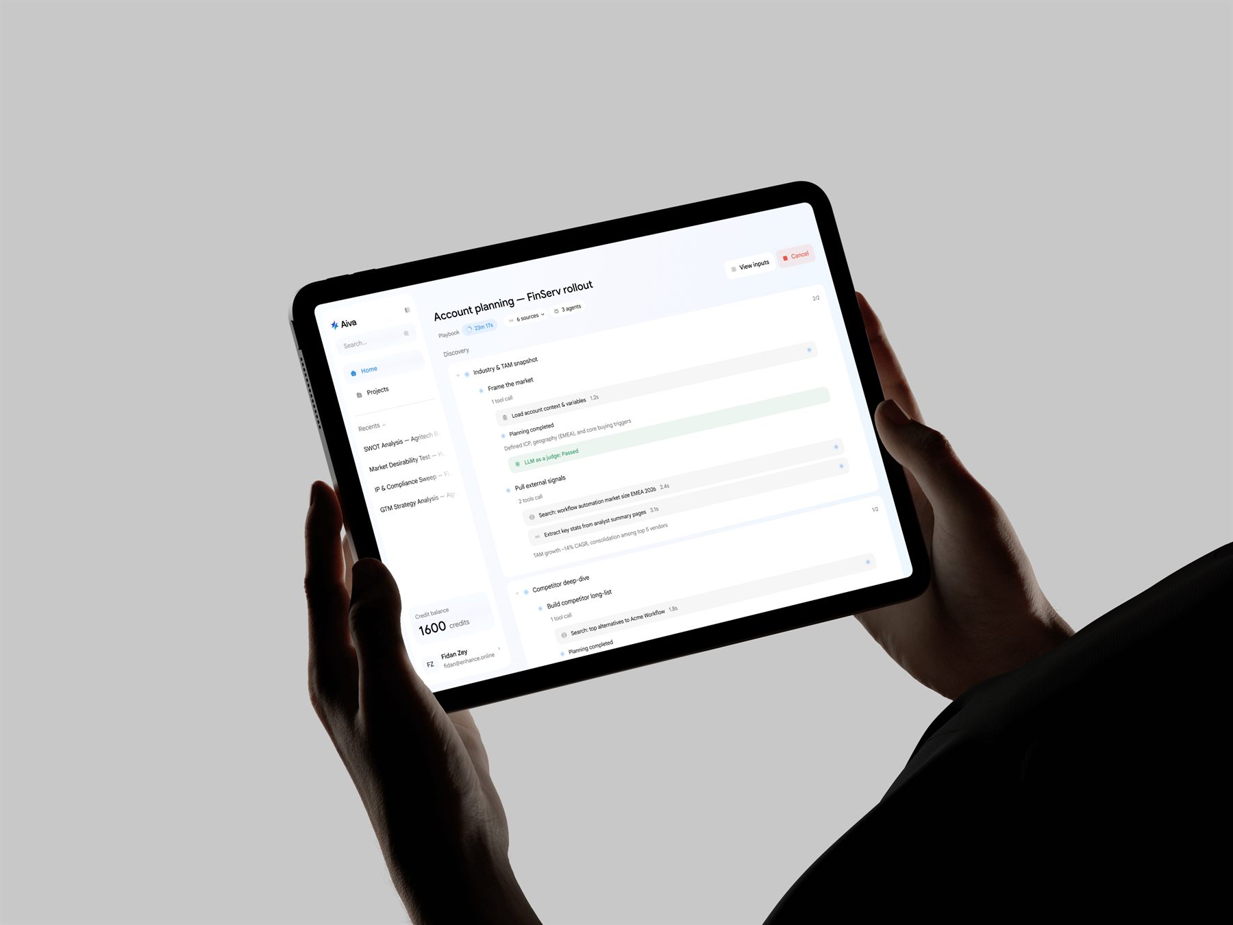 Tablet mockup held in hands showing the Aiva account planning playbook interface